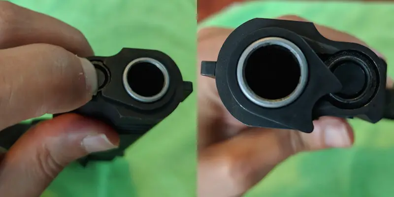 compress recoil spring and rotate barrel bushing