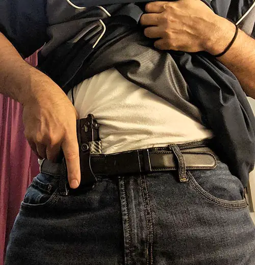 unholster from appendix carry position