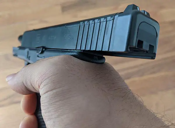 how hard to hold a pistol and where to hold to avoid slide bite