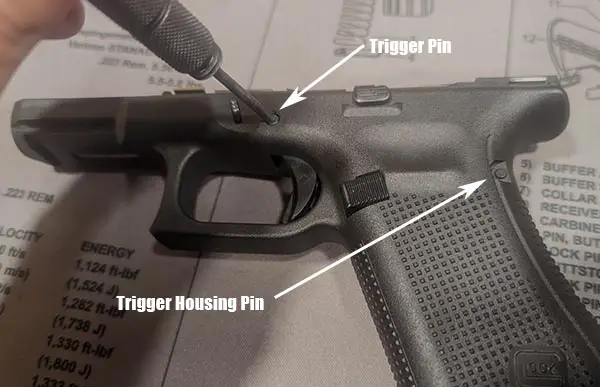 Take apart Glock frame by removing the pins